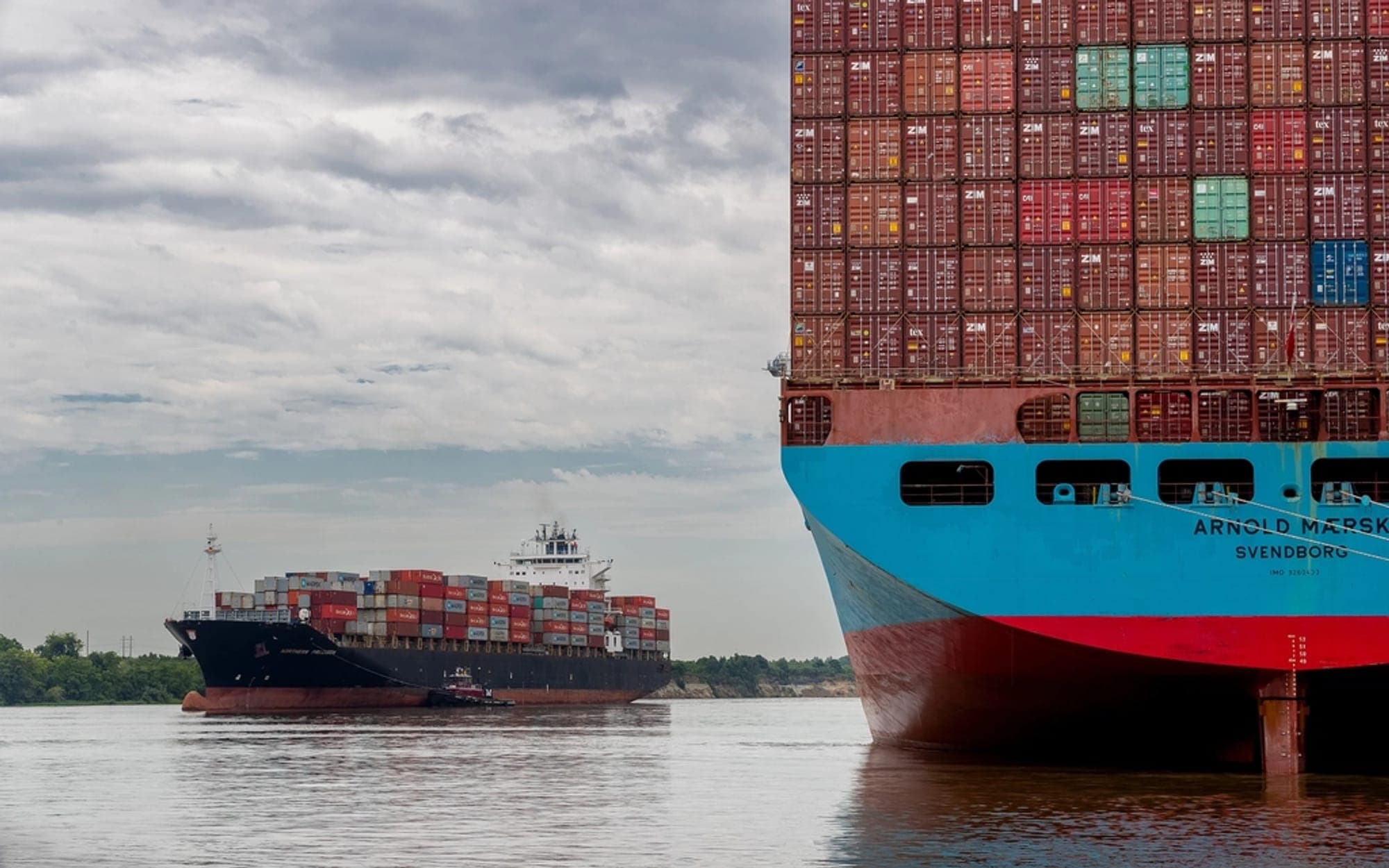 Container ship loaded with containers on a river