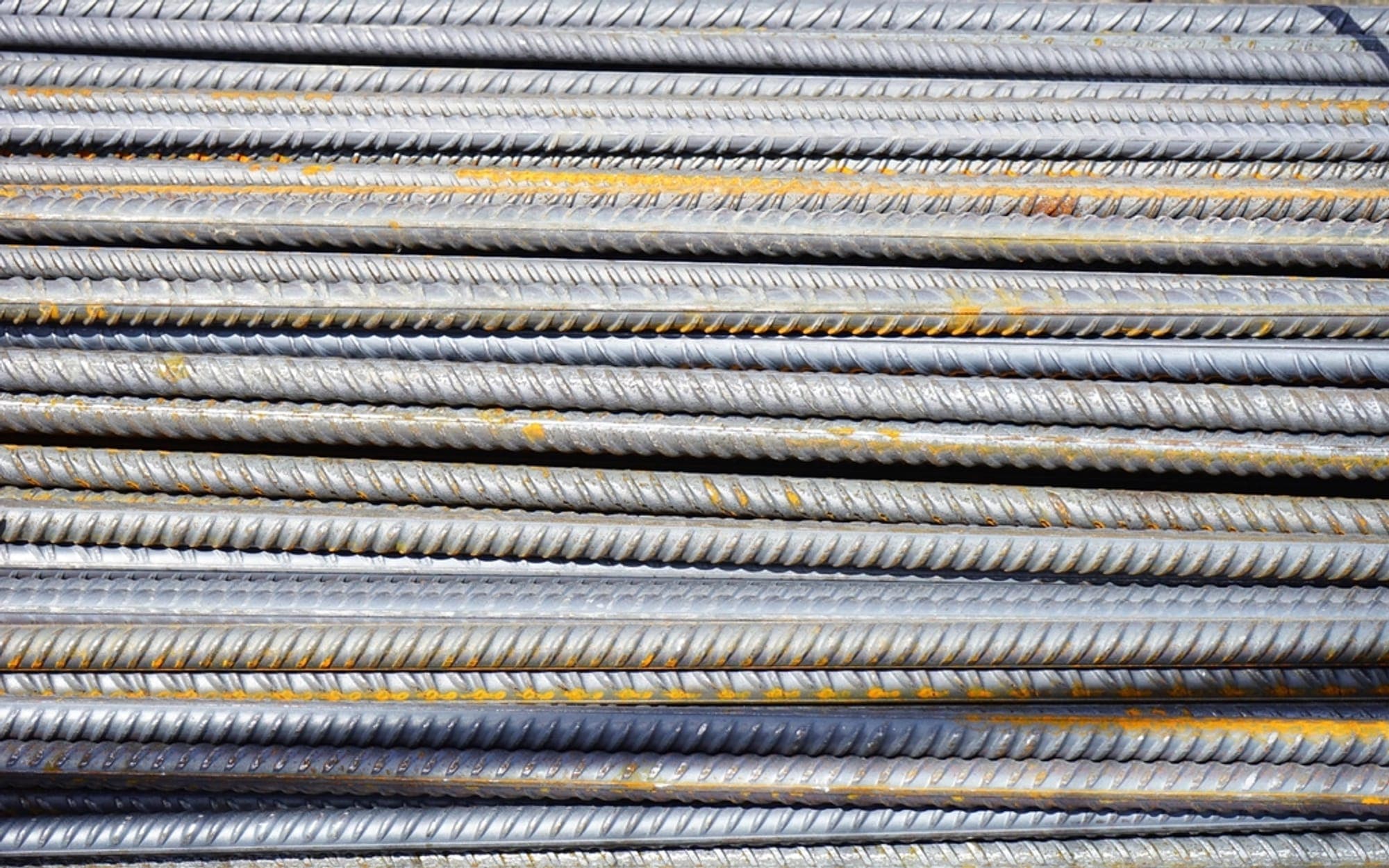 Bundles of ribbed steel reinforcing bar stacked together