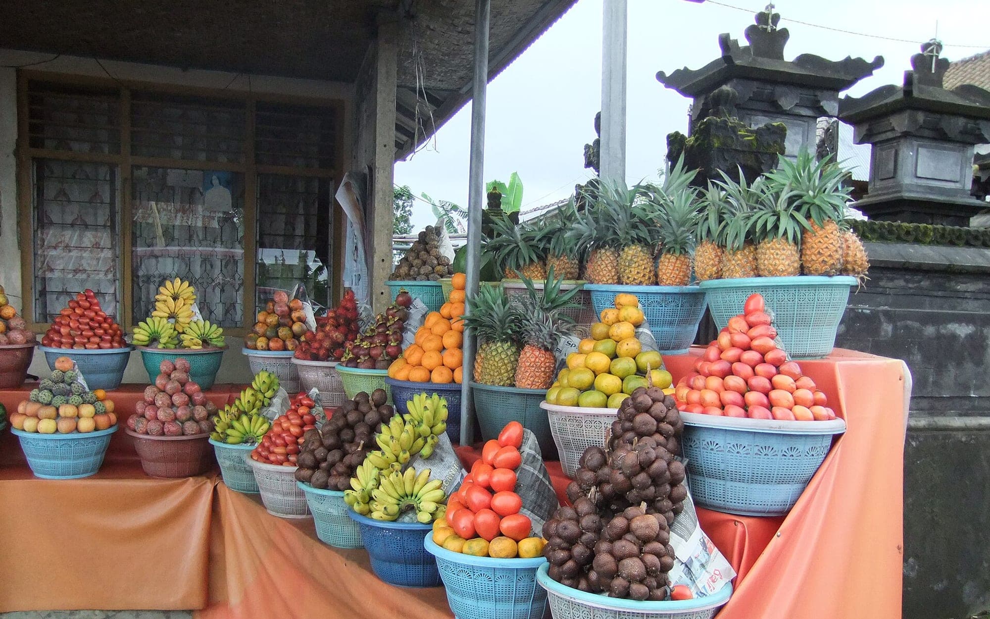 Tropical fruit displayed together at a market stall