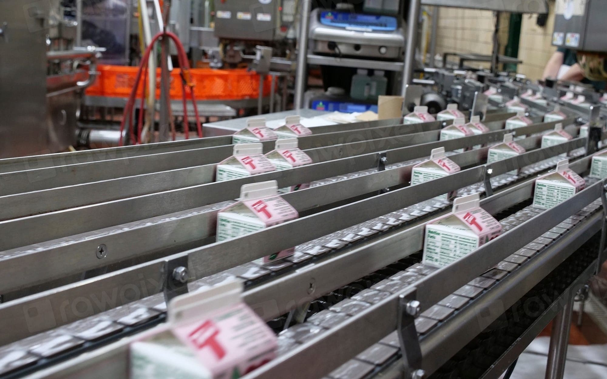 Small packed boxes travelling along a sorting conveyor