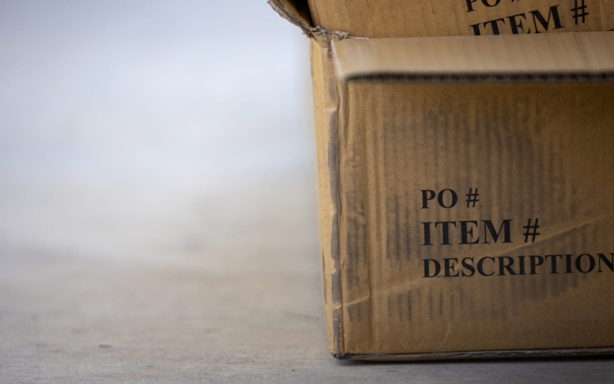Cardboard carton printed with order and item reference fields